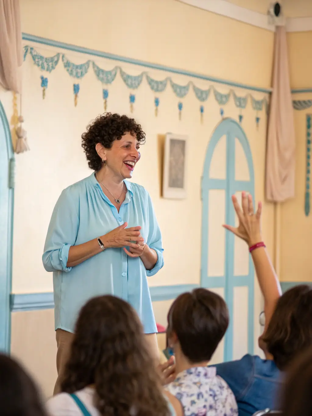 An image of a young professional confidently delivering a presentation in front of an audience, illustrating oral presentation coaching.